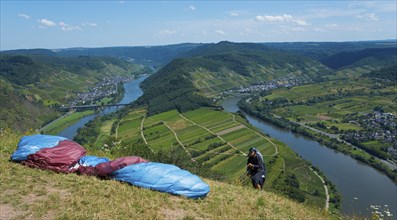 Paraglider ready, view over the river landscape and green hills, paragliding, Bremm, Cochem,