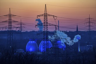 Digesters of the Emscher sewage treatment plant Bottrop, illuminated, high-voltage pylons, North