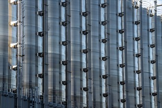 Stainless steel tanks of a large silo facility in Duisburg inland harbour, Duisburg-Neuenkamp, for