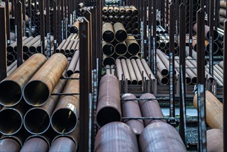 Warehouse for steel pipes in Duisburg harbour, steel pipes in various diameters, North