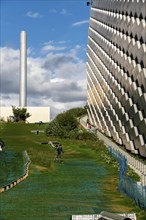 CopenHill, waste incineration plant and artificial ski slope, skiing with a view of the ski lift,