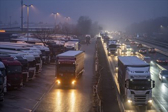 Heavy traffic on the A2 at the Bottrop-Süd service area, overcrowded lorry parking in the evening,