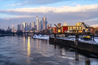 The skyline of Frankfurt am Main, skyscrapers of the banking district, historic harbour cranes at