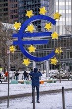 Winter in Frankfurt, euro sculpture at Willy-Brandt-Platz, snow-covered, Hesse, Germany, Europe