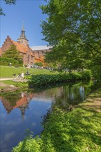 Odense, green area, monastery, brick building, stepped gable, tower of the cathedral church, St.