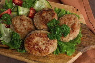 Fried cutlets, turkey, with vegetable salad, top view, no people