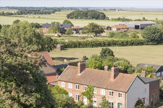 North Sea village landscape over fields in summer at Bawdsey, Suffolk, England, UK view from church