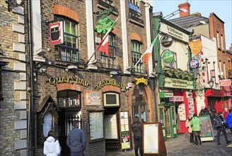 Colourful pub exteriors flags and beer signs, Temple bar area, Dublin city centre, Ireland,