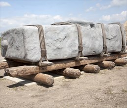 Replica of megalithic transportation of large stones at the Stonehenge visitor attraction site,