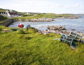 Small fishing boat at moorings on the east coast of Barra, Outer Hebrides, Scotland, UK