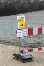 Barrier due to flooding and danger of falling rocks, barrier, landslide, traffic signs, attention