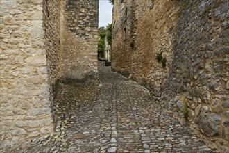 Natural stone walls and paths in La Roque-sur-Cèze, Département Gard, Occitanie region, France,