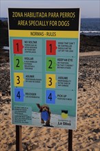 Notice sign of beach rules for area specially for dogs, Corralejo, Fuerteventura, Canary Islands,