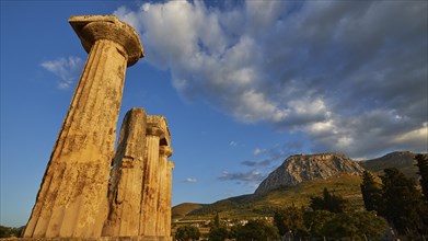 Archaic Temple of Apollo, Doric Columns, Doric columns of ancient ruins under a dramatic sunset