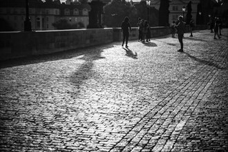 Tourists on Charles Bridge, morning mood, black and white, Prague, Czech Republic, Europe