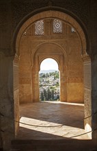 Stone arches in Islamic key shape in the Generalife palace, Alhambra, Granada, Spain, Europe