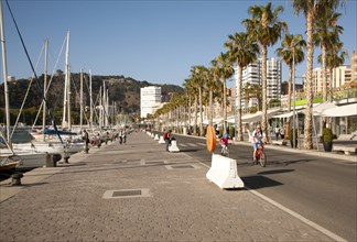 People walking in the newly redeveloped port area of shops and bars Malaga, Spain, Muelle dos,