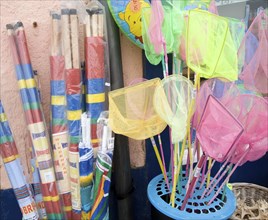 Windbreaks and children's fishing nets on sale at the seaside town of Cromer, north Norfolk coast,