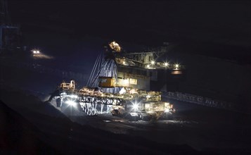 Lignite excavators extract coal in the Welzow open-cast mine, operated by LEAG. The lignite is