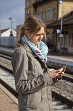 Young woman at a railway station in the provinces