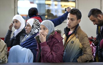 Syrian refugees arrive at Schönefeld station on a special train. They are then taken by bus to