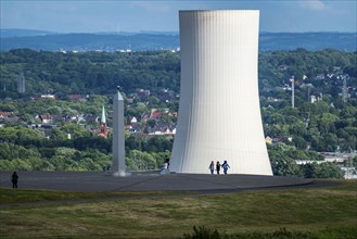 Cooling tower of the STEAG combined heat and power plant in Herne and the obelisk of the sundial,