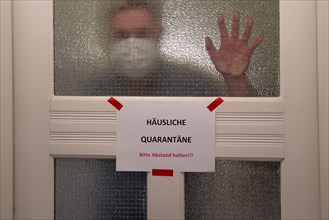 Symbolic image Domestic quarantine, man is in isolation at home due to a suspected corona