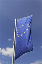 Flag of the European Union in front of a blue sky