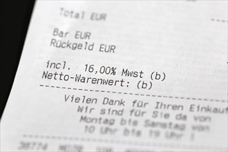 Close-up of a till receipt showing the reduction in VAT to sixteen per cent in Germany due to the