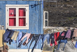 Laundry drying in the wind in front of the house, Inuit settlement, Ittoqqortoormiit, East