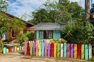 Pastel-coloured house with colourful fence, colourful, colourful, imaginative, living, building,