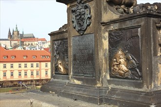 The bronze statue of St John Nepomuk on Charles Bridge, Prague, Czech Republic, Europe