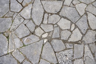 Mosaic of stone slabs on a garden terrace, full-size