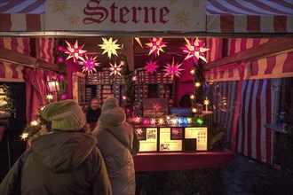 Christmas stall with paper stars, Christkindlesmarkt, Nuremberg, Middle Franconia, Bavaria,