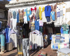 Textiles and clothes hanging oustide shop in medina area of Essaouira, Morocco, north Africa,