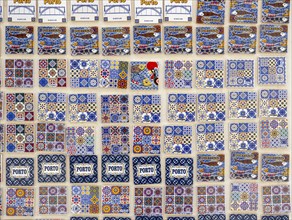 A display of ceramic fridge magnets, modeled after the iconic azulejo tiles, for sale in Porto,