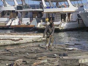 Labourer, boat building and repairs, yacht shipyard, Hurghada, Egypt, Africa