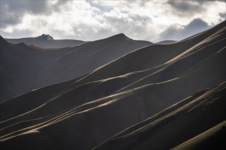 Mountain silhouette and hills in the sunlight, Dramatic mountain landscape, Tian Shan, Sky