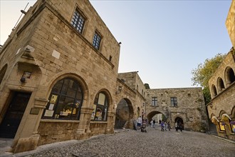 Museum Square, super wide angle shotAn old town street with cobblestones, surrounded by historic