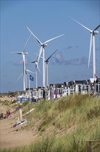 Wind turbines, wind farm, holiday homes, beach houses on the beach of Ijmuiden in North Holland,