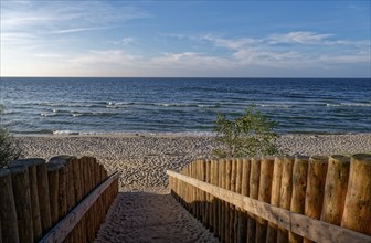 Palisaded path to the sandy beach on the coast in the Wolin National Park, also known as Wollin, on