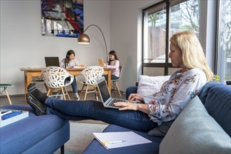 Homeschooling, during the lockdown in January 2021, children learning at home for school, a girl in