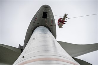 Height rescuers from the Oberhausen professional fire brigade practise abseiling from a wind