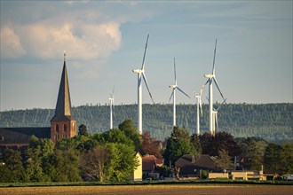 Wind farm in Kirchherten, St Martinus Catholic parish church, in the Rhenish lignite mining area,