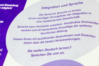 Symbolic image of integration: advertising for a German course at an adult education centre