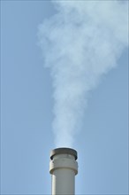 Smoking chimney of a lignite-fuelled combined heat and power plant, Germany, Europe