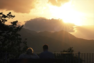 Couple watches the sunset on mountains, Sepino, Molise, Italy, Europe