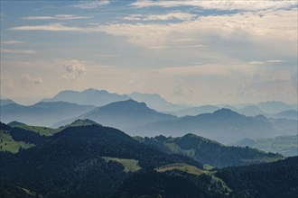 View from the Spitzstein to the silhouettes of the Loferer and Chiemgau Alps, Erl, Tyrol, Austria,