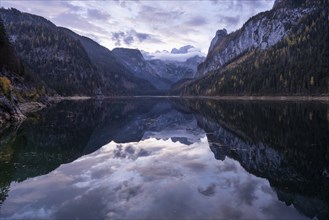 The Vordere Gosausee lake in the morning in autumn with a view of the Dachstein mountain range. The