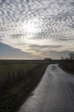 A mackerel sky or buttermilk sky of altocumulus clouds over Shingle Street, Suffolk, England,